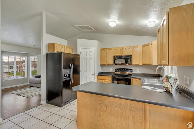 883 W 660 S, Tooele, UT 84074 - kitchen featuring a sink, a peninsula, black appliances, light brown cabinets, and dark countertops