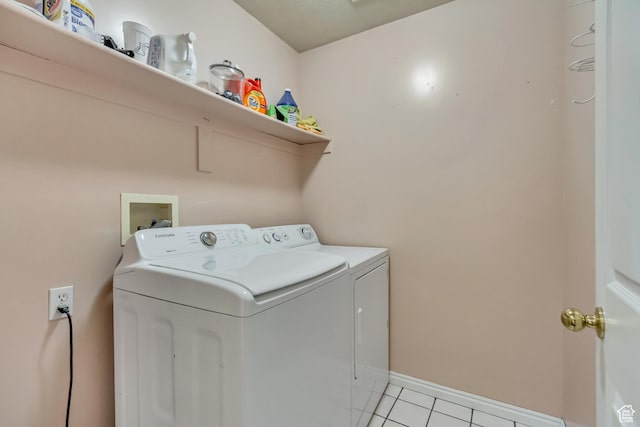 883 W 660 S, Tooele, UT 84074 - washroom featuring washer and dryer, laundry area, light tile patterned floors, and baseboards