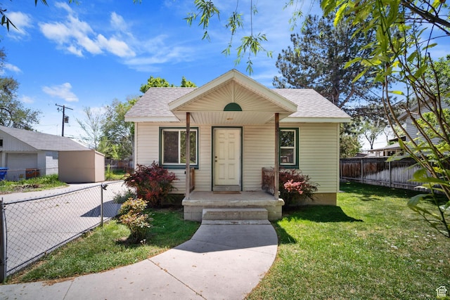 370 E Scott Ave, South Salt Lake, UT 84115 - bungalow-style house with fence, a shingled roof, and a front lawn