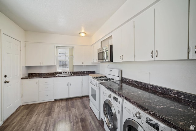 370 E Scott Ave, South Salt Lake, UT 84115 - washroom with washer and dryer, a sink, laundry area, a textured ceiling, and dark wood-type flooring