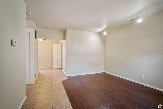 370 E Scott Ave, South Salt Lake, UT 84115 - spare room featuring baseboards, tile patterned flooring, visible vents, and track lighting