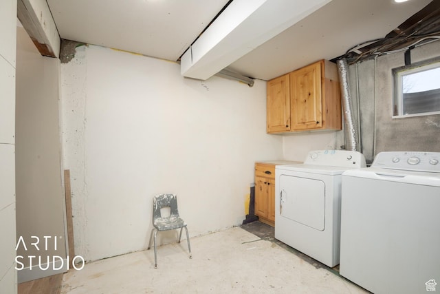 laundry room featuring cabinet space and washer and dryer