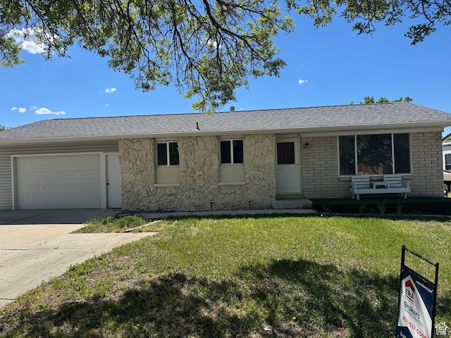 single story home with an attached garage, a front lawn, driveway, entry steps, and roof with shingles