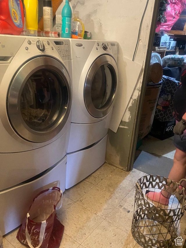 washroom with laundry area and separate washer and dryer