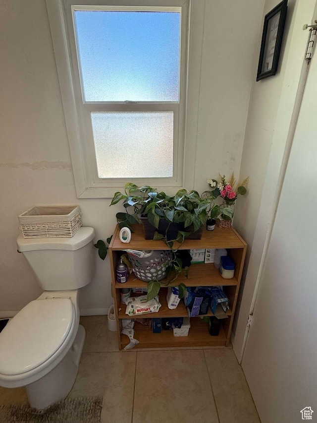 3274 W 3100 S, West Valley City, UT 84119 - bathroom featuring tile patterned flooring, toilet, and baseboards