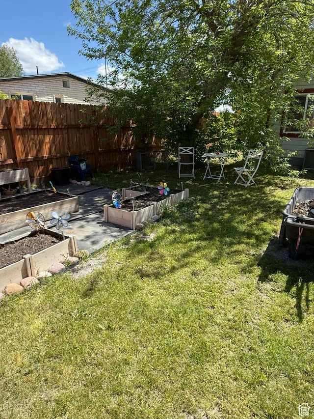 3274 W 3100 S, West Valley City, UT 84119 - view of yard featuring a garden and fence