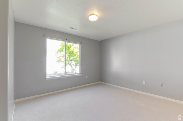 770 N Quincy Ave, Ogden, UT 84404 - empty room featuring light colored carpet, visible vents, and baseboards