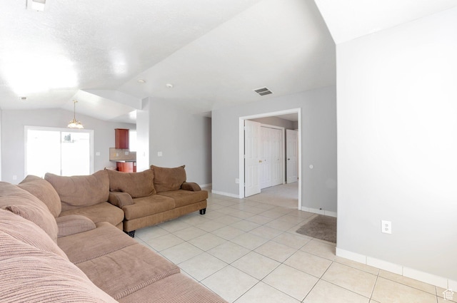 770 N Quincy Ave, Ogden, UT 84404 - living area featuring vaulted ceiling, baseboards, light tile patterned floors, and visible vents