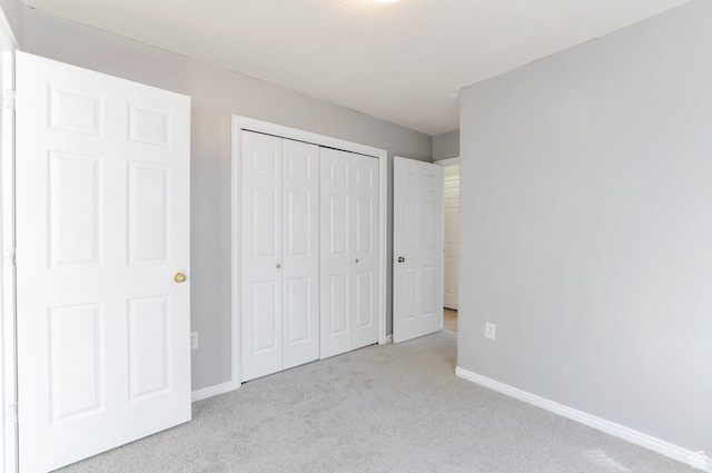 770 N Quincy Ave, Ogden, UT 84404 - unfurnished bedroom with carpet flooring, a closet, and baseboards