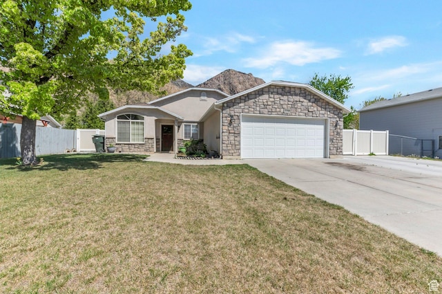 ranch-style home featuring stone siding, an attached garage, fence, concrete driveway, and a front lawn