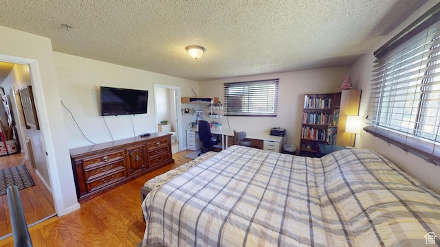 983 E Antelope Dr N, Layton, UT 84040 - bedroom with a textured ceiling and light wood-style floors