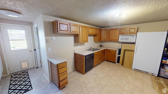 983 E Antelope Dr N, Layton, UT 84040 - kitchen featuring white appliances, a sink, a textured ceiling, light floors, and light countertops