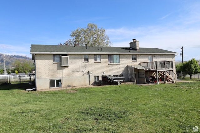 983 E Antelope Dr N, Layton, UT 84040 - rear view of house featuring stairs, a deck, a chimney, brick siding, and central air condition unit