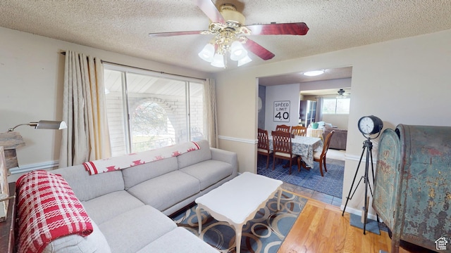 983 E Antelope Dr N, Layton, UT 84040 - living area with ceiling fan, wood finished floors, and a textured ceiling