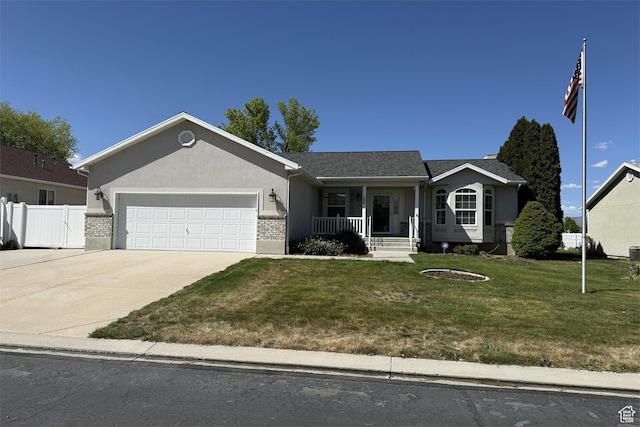 166 E Cove Rd, Saratoga Springs, UT 84045 - ranch-style house featuring a porch, a garage, driveway, stucco siding, and brick siding