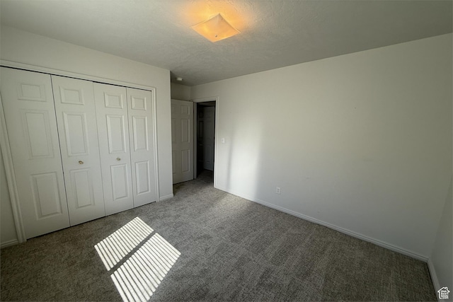 166 E Cove Rd, Saratoga Springs, UT 84045 - unfurnished bedroom featuring carpet, a closet, baseboards, and a textured ceiling