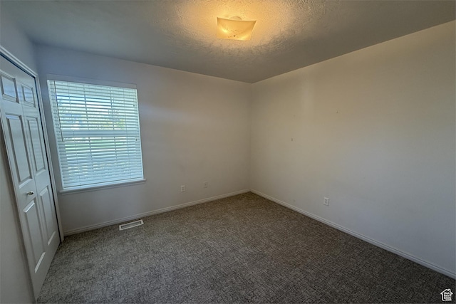 166 E Cove Rd, Saratoga Springs, UT 84045 - spare room featuring a textured ceiling, carpet flooring, and baseboards