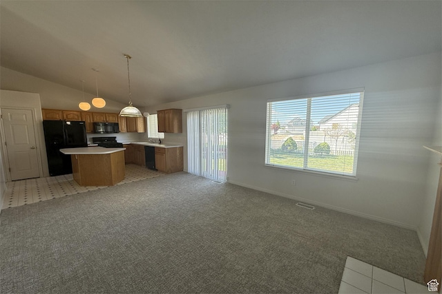 166 E Cove Rd, Saratoga Springs, UT 84045 - kitchen with black appliances, a center island, light countertops, open floor plan, and lofted ceiling