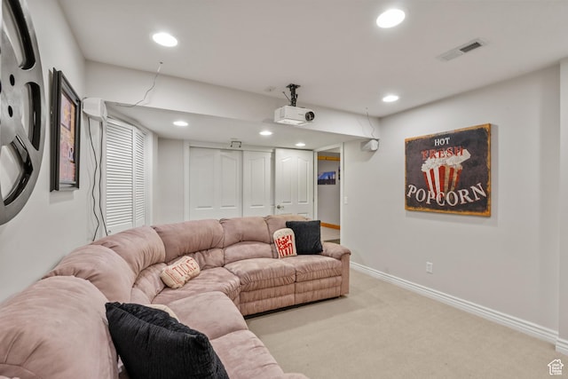 living area with carpet, baseboards, visible vents, and recessed lighting