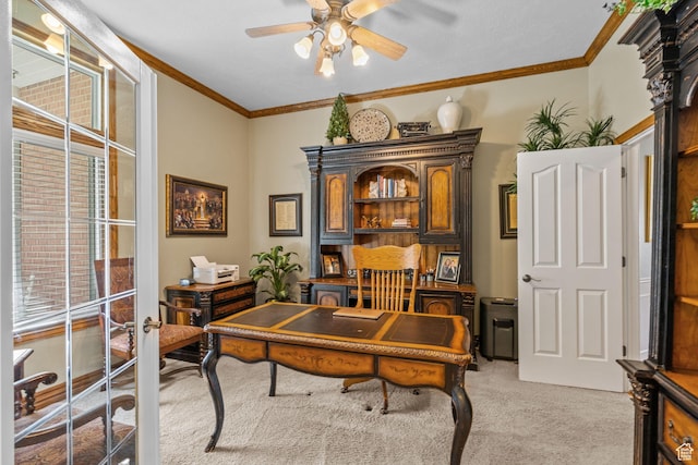 office area with ornamental molding, ceiling fan, and light colored carpet