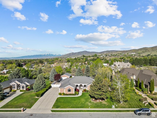 birds eye view of property with a mountain view and a residential view