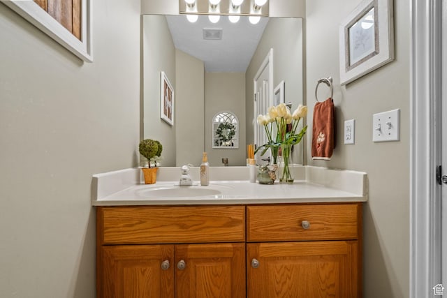 bathroom featuring vanity and visible vents