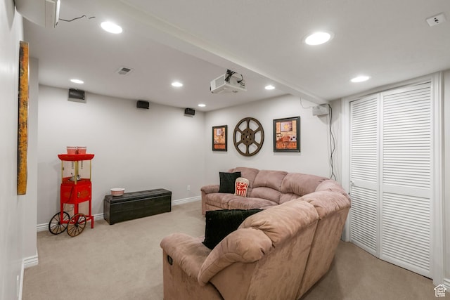 living area featuring baseboards, visible vents, recessed lighting, and light colored carpet