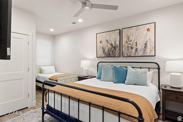 bedroom with visible vents, wood finished floors, ceiling fan, and recessed lighting