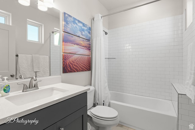 full bath featuring vanity, toilet, and shower / bath combination with curtain