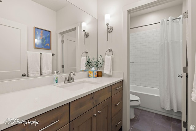 bathroom with toilet, tile patterned floors, vanity, and shower / bath combo