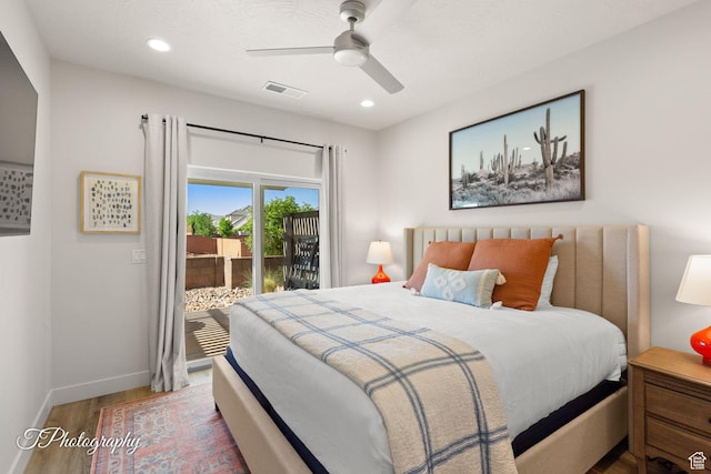 bedroom featuring wood finished floors, baseboards, visible vents, recessed lighting, and access to outside