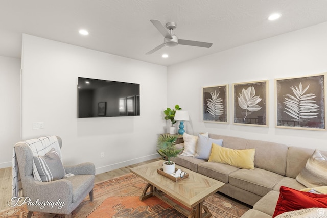 living room with wood finished floors, baseboards, ceiling fan, and recessed lighting