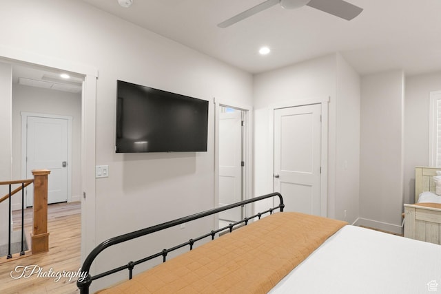 bedroom with wood finished floors, baseboards, ceiling fan, and recessed lighting
