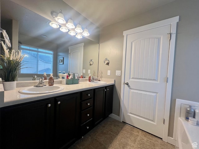 642 W Mulberry St, Stansbury Park, UT 84074 - full bathroom featuring double vanity, tile patterned flooring, a washtub, and a sink