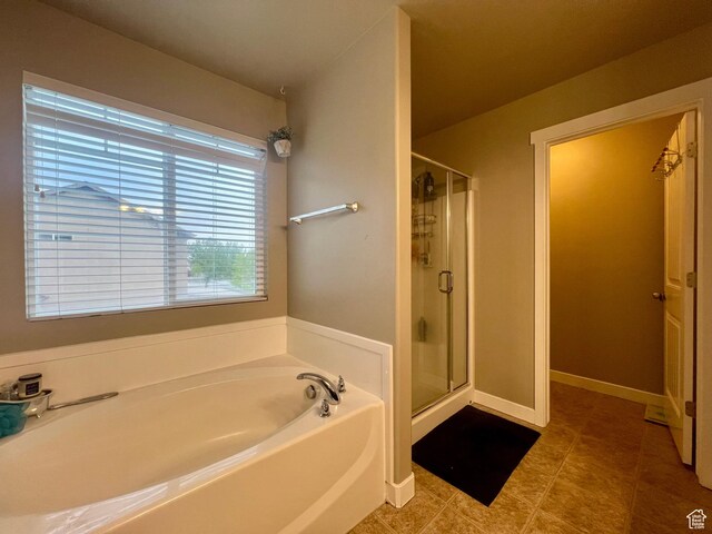642 W Mulberry St, Stansbury Park, UT 84074 - full bath featuring a garden tub, tile patterned flooring, and a stall shower