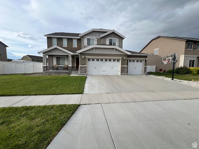 642 W Mulberry St, Stansbury Park, UT 84074 - craftsman house with stone siding, a front lawn, fence, and a garage