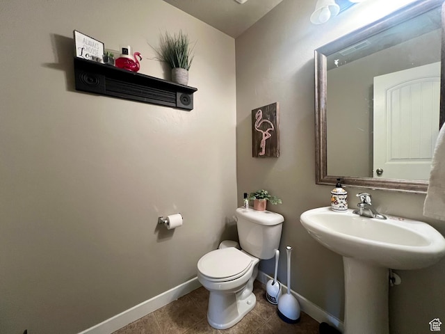 642 W Mulberry St, Stansbury Park, UT 84074 - bathroom featuring toilet, a sink, visible vents, baseboards, and tile patterned flooring