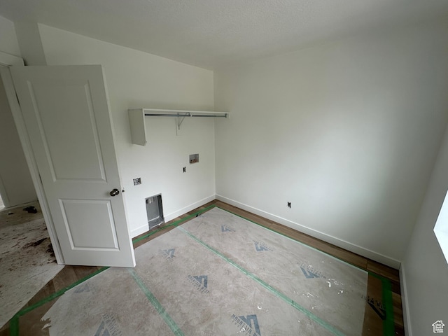 laundry area with laundry area and baseboards