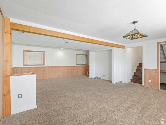 601 E Valley Dr, Heber City, UT 84032 - finished below grade area featuring stairs, carpet flooring, a wainscoted wall, and wood walls