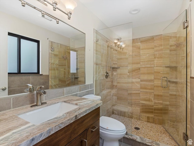601 E Valley Dr, Heber City, UT 84032 - full bathroom featuring a shower stall, tile walls, vanity, and toilet