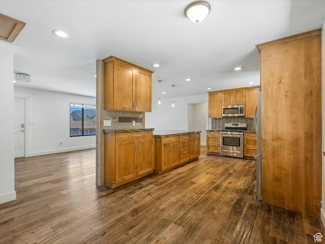 601 E Valley Dr, Heber City, UT 84032 - kitchen with tasteful backsplash, dark wood-type flooring, recessed lighting, baseboards, and appliances with stainless steel finishes