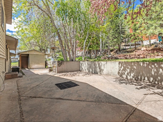 601 E Valley Dr, Heber City, UT 84032 - view of patio / terrace with cooling unit, an outbuilding, and a shed