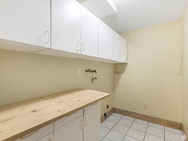 601 E Valley Dr, Heber City, UT 84032 - laundry room with cabinet space, washer hookup, hookup for an electric dryer, baseboards, and light tile patterned flooring