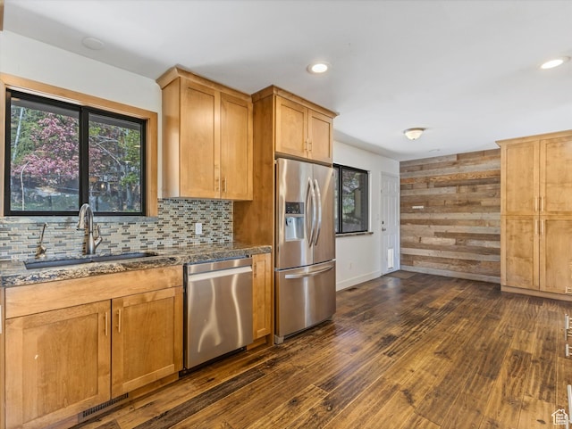 601 E Valley Dr, Heber City, UT 84032 - kitchen featuring a sink, dark stone countertops, backsplash, appliances with stainless steel finishes, and dark wood-style floors