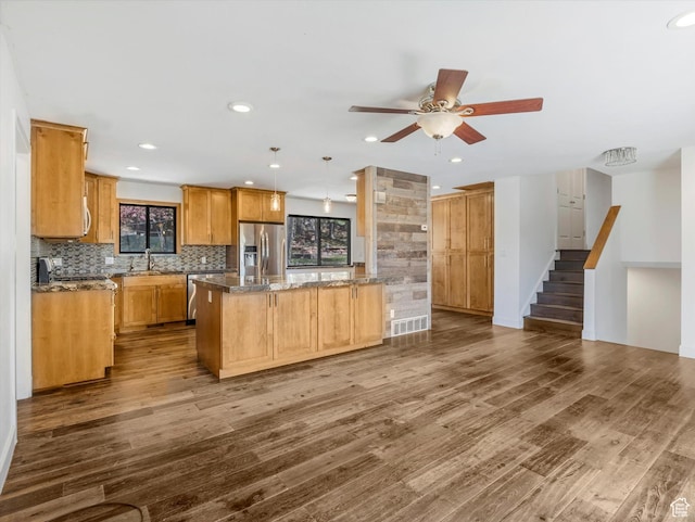 601 E Valley Dr, Heber City, UT 84032 - kitchen with dark wood-type flooring, ceiling fan, appliances with stainless steel finishes, decorative backsplash, and recessed lighting