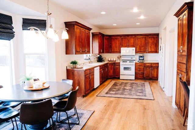 290 W 300 N, Beaver, UT 84713 - kitchen with white appliances, a sink, light countertops, light wood-style floors, and recessed lighting
