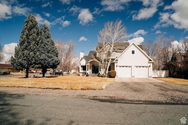 290 W 300 N, Beaver, UT 84713 - traditional-style home with a chimney, concrete driveway, and an attached garage