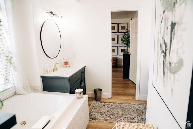 290 W 300 N, Beaver, UT 84713 - bathroom featuring a bath, vanity, wood finished floors, and baseboards