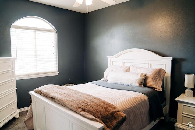 290 W 300 N, Beaver, UT 84713 - bedroom featuring multiple windows, dark colored carpet, and a ceiling fan