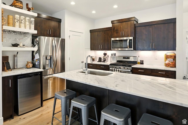 2237 N 450 W, Layton, UT 84041 - kitchen with a sink, stainless steel appliances, open shelves, and a kitchen bar